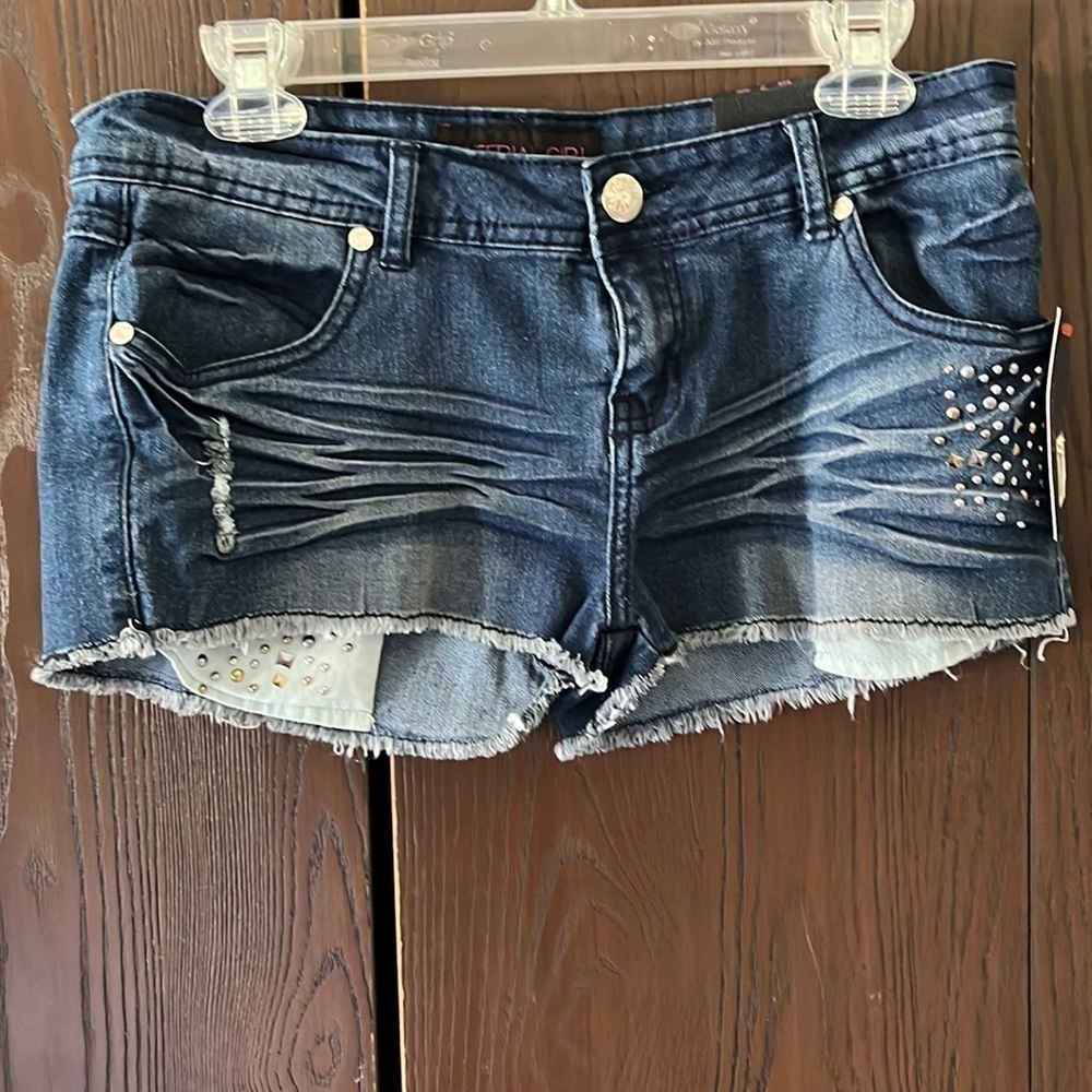 Material Girl blue jean short shorts with studded pocket. Size 7 NWT